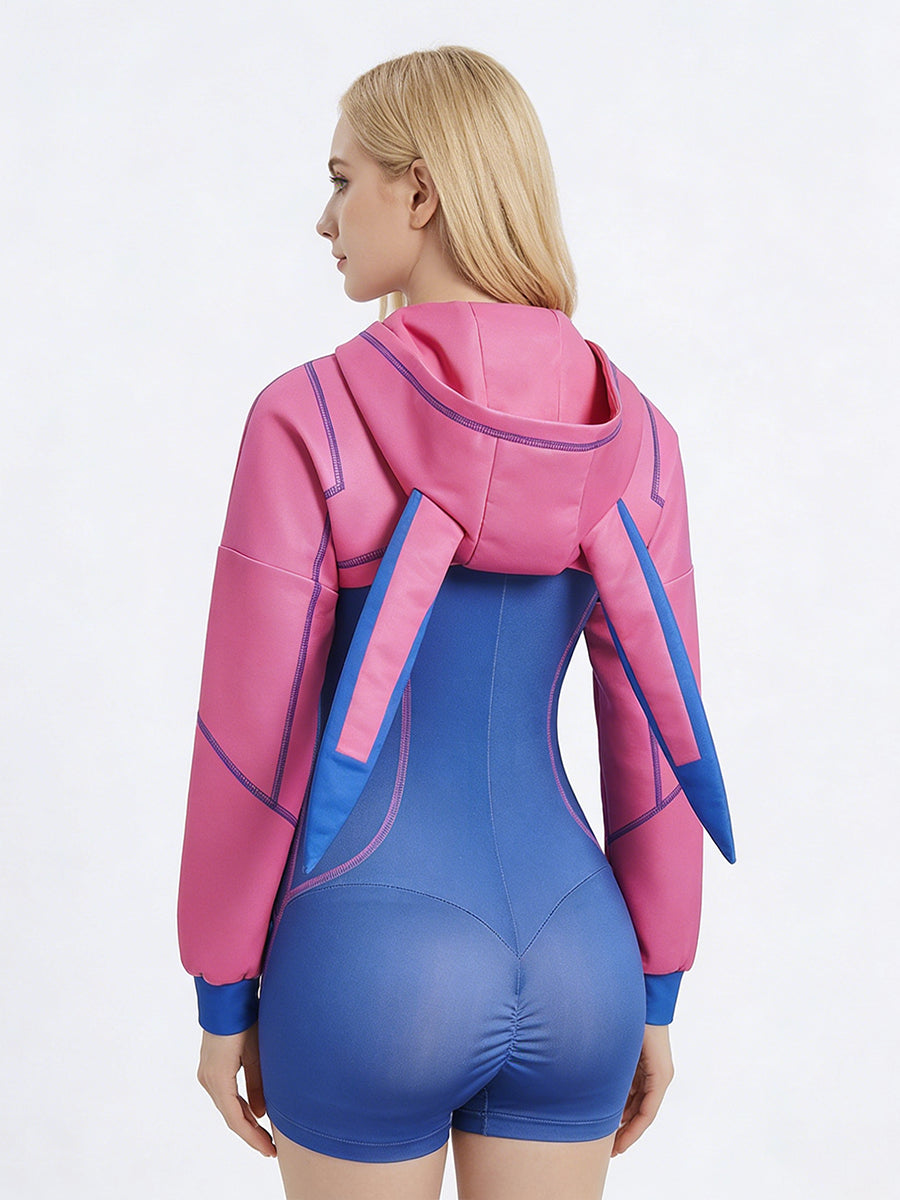 Back view of Cyber Bunny Heroine cosplay showing the form-fitting blue romper and the standing bunny ears on a pink hooded shrug.