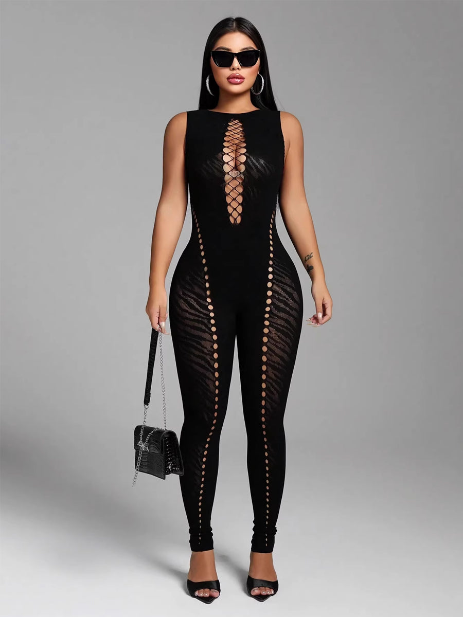 Women's Costume Inspire black seamless jumpsuit styled with sunglasses and handbag for clubwear.